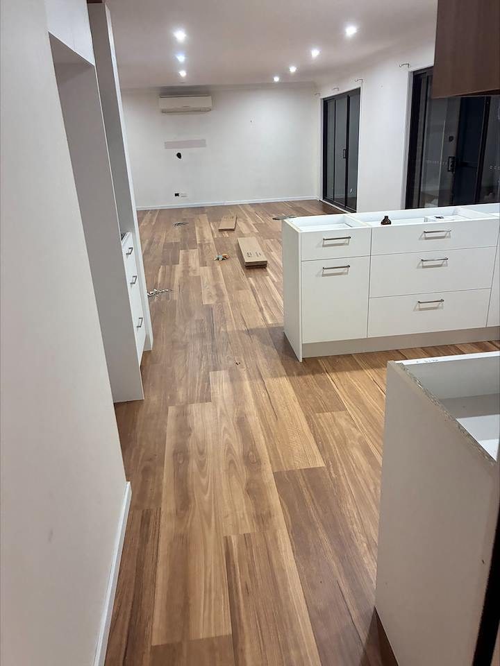Timber flooring in a modern open-plan kitchen and living space